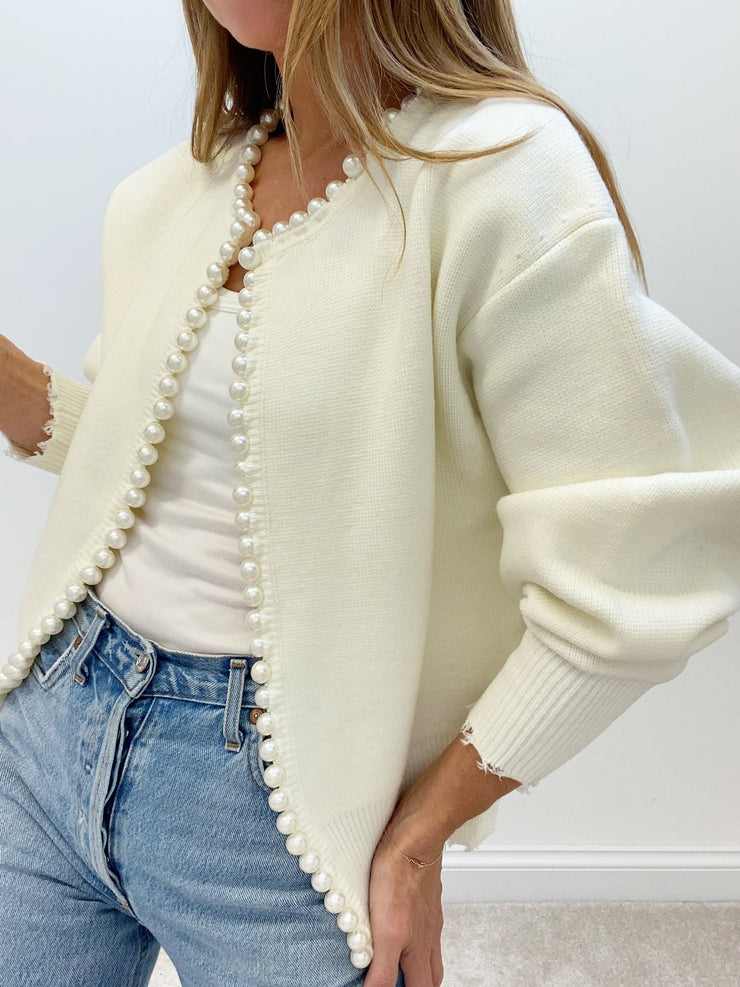 Women's trimmed ripped hem cardigan